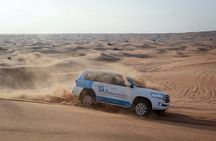 Abu Dhabi desert safari with BBQ, camel ride and sandboarding