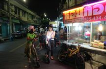 Guided e-scooter night tour with local street food