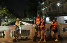 Guided e-scooter night tour with local street food