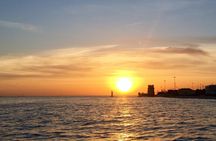Small-group Lisbon sunset sailing cruise with a welcome drink