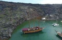 Volcanic islands sunset dinner cruise in Santorini