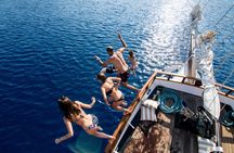 Volcanic islands sunset dinner cruise in Santorini