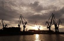 Sunset on the shipyard and old town cruise in Gdansk