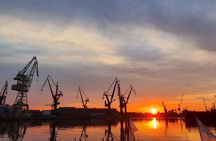 Sunset on the shipyard and old town cruise in Gdansk