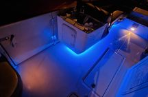 Tagus river night cruise with glass of champagne