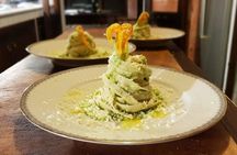 Cooking class of traditional recipes with a full meal in Alghero