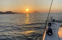 Milos sunset catamaran to Kleftiko with appetizers and drinks