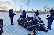 Traditional snowmobile safari in Levi to reindeer farm