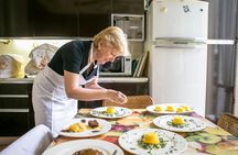 Market tour and dining experience at a Cesarina's home in Modena