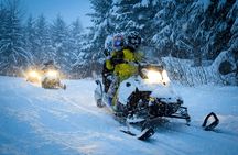 Snowmobile or quad ride and thermal pools day trip from Zakopane