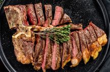 Florentine-style steak cooking experience with a chef and unlimited wine