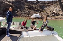 Catamaran cruise along Santorini's coastline from Fira