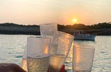 Golden hour boat tour with sunset views of Macarella in Menorca