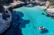 Golden hour boat tour with sunset views of Macarella in Menorca
