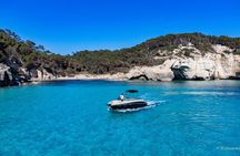 Golden hour boat tour with sunset views of Macarella in Menorca