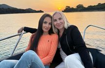 Coastline sunset cruise with a glass of cava