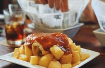 Barcelona district tour with traditional tapas tasting