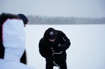 Ice fishing small group experience with BBQ from Rovaniemi
