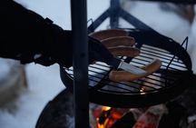 Ice fishing small group experience with BBQ from Rovaniemi