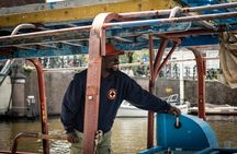 Canal cruise on a wooden refugee boat