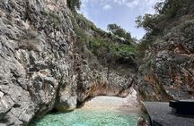 Guided boat trip to Grama Bay