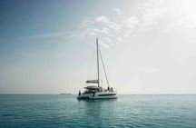 Sardinian coastline catamaran tour with multiple stops