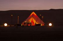Huacachina desert glamping experience with dinner and sandboarding