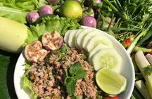 Lao cooking class on a Mekong River boat with market visit