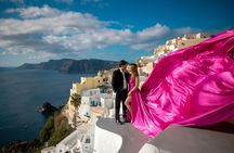 Santorini flying dress photoshoot with caldera and Oia views