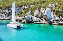 Full-Day Porto Conte Natural Park Catamaran Tour from Alghero