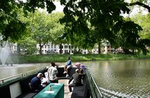 Utrecht canal cruise in open boat with drink and audio guide