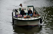 Utrecht canal cruise in open boat with drink and audio guide