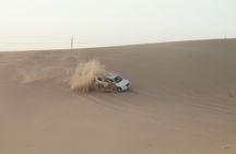 Desert safari with sandboarding and dinner from Dubai