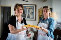 Market tour, lunch or dinner and show cooking at a Cesarina's home in Bologna