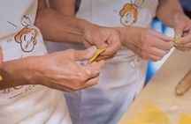 Market tour, cooking class and lunch or dinner at a Cesarina's home in Bologna