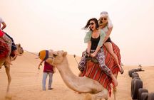 Dubai desert adventure with buggy, dune bashing and camel ride