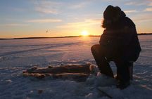 Guided ice fishing experience in Luleå