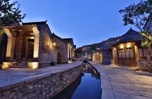 Beijing Evening Tour: illuminated Great Wall and Gubei Water Town