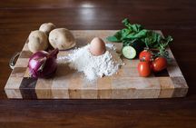 Local market visit and private cooking class at a Cesarina's home in Perugia