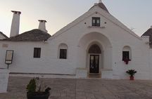 Private guided tour in Alberobello with free tasting: discovering the trulli