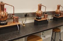 Distill a bottle of gin on mini copper stills