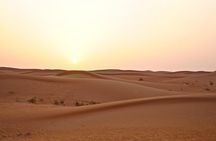 Dubai Red Dunes Safari by Quad Bike, Sand boarding, Camel Ride & BBQ Dinner