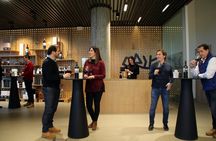 Guided tour glass in hand with wine tasting directly from the barrel