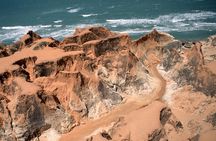 The colorful sands of Morro Branco beach - Full Day Tour