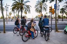 Barcelona Night Bike Tour with Local Tapas and Cava Stop