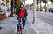 Barcelona Night Bike Tour with Local Tapas and Cava Stop