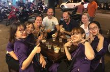 Private Ho Chi Minh Street Food Tour by Motorbike with Ao Dai Female Rider