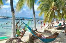 Live this unique experience. Catamaran to Isla Mujeres Tour. Open Bar included.