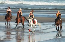 Riding a Horse to Enjoy the Extremely Black Sand Beach