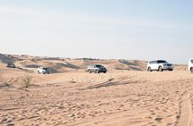 Exclusive Sunrise Desert Safari with Camel Ride Sand Boarding Dune Bashing